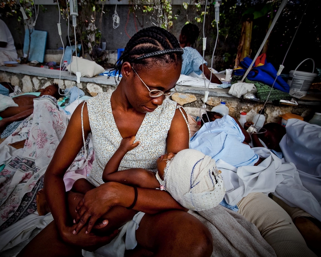A mother and baby receive medical care after the earthquake in Haiti 2010