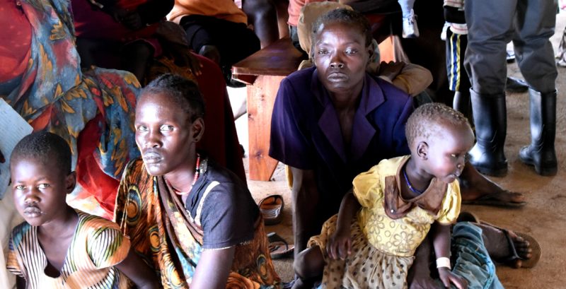 Two mothers with their children, who lived in South Sudan and sought refuge in the Uganda refugee settlement