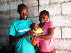 Jaqueline and her daughter Altinise, hold Altinise's beautiful daughter