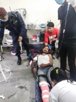 A Nepalese man truck driver being stabilized on a stretcher