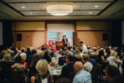 Melissa Fleming, head spokesperson for the UN Refugee Agency, speaks at Portland's Healthy Women, Healthy World luncheon