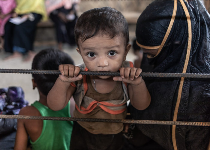 One-year old Omar Faruk receives treatment for injuries and prevention against disease in a refugee camp in Bangladesh.