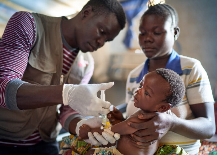 4-month old refugee boy, Jeremy, receives medicinal treatment for sever pneumonia in the Maratatu settlement in Uganda.