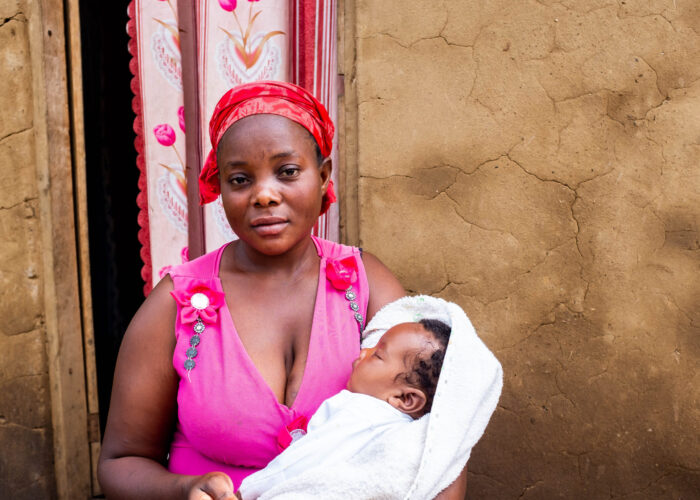 Mother Janet Manihiro welcoming her new baby girl, Vanessa Asante, in Uganda.