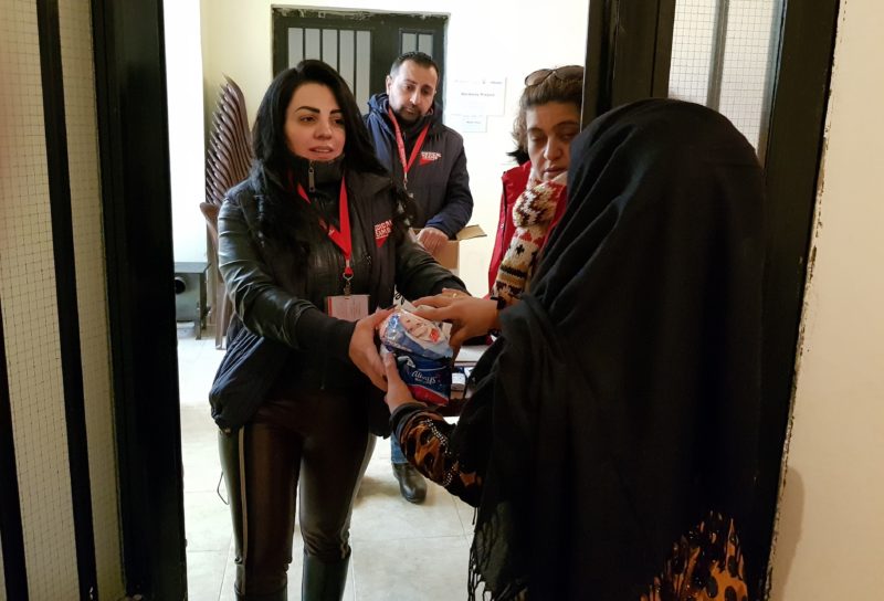 Medical Teams staff distributing supplies to people affected by the storms