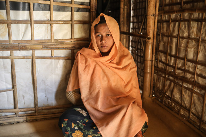 Nur Ankiz sits on the floor of her home in the Kutupalong refugee camp in Bangladesh