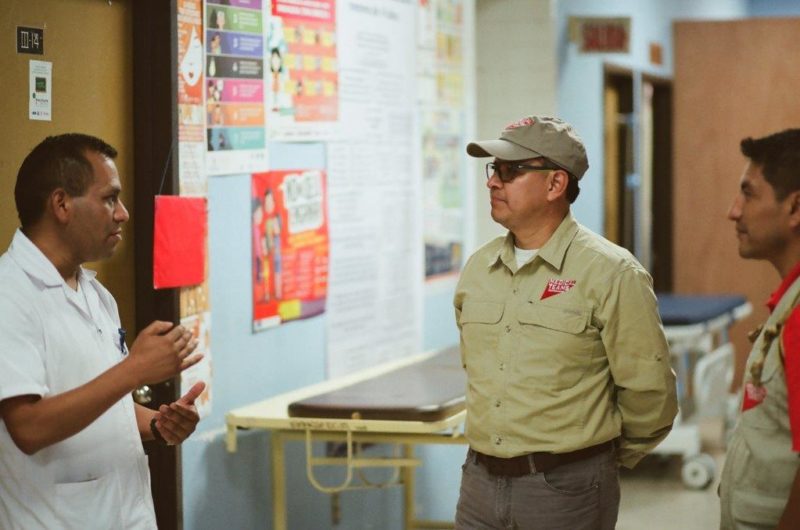 Director of Nursing, Profirio Aguliar, talks to a Medical Team staff at Uspantán National Hospital