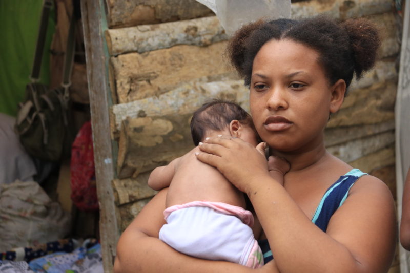 Stephanie, a new mother, living in the dumps outside of Colombia after leaving Venezuela 