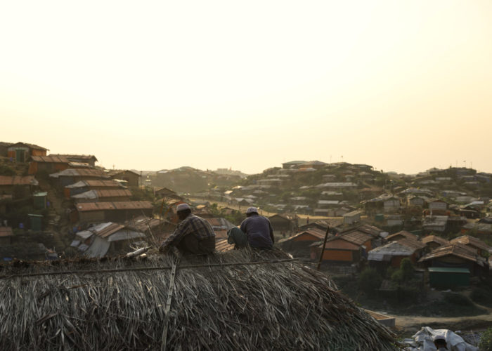 Bangladesh, men repairing roof, 2019