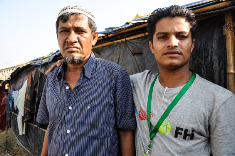 Redwan, a Bangladesh Rohingya refugee, posing with his father after escaping attack