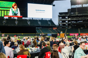 audience looking up at jumbo screen