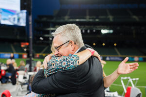 man and woman hugging