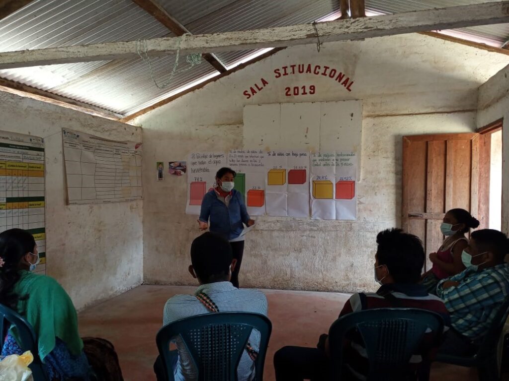 Woman presenting to small group