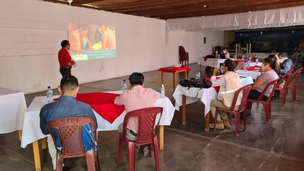 Man making presentation to a small group