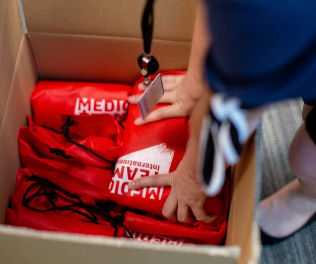 Medical Teams bags of hygiene kits are packed into a box for distribution.