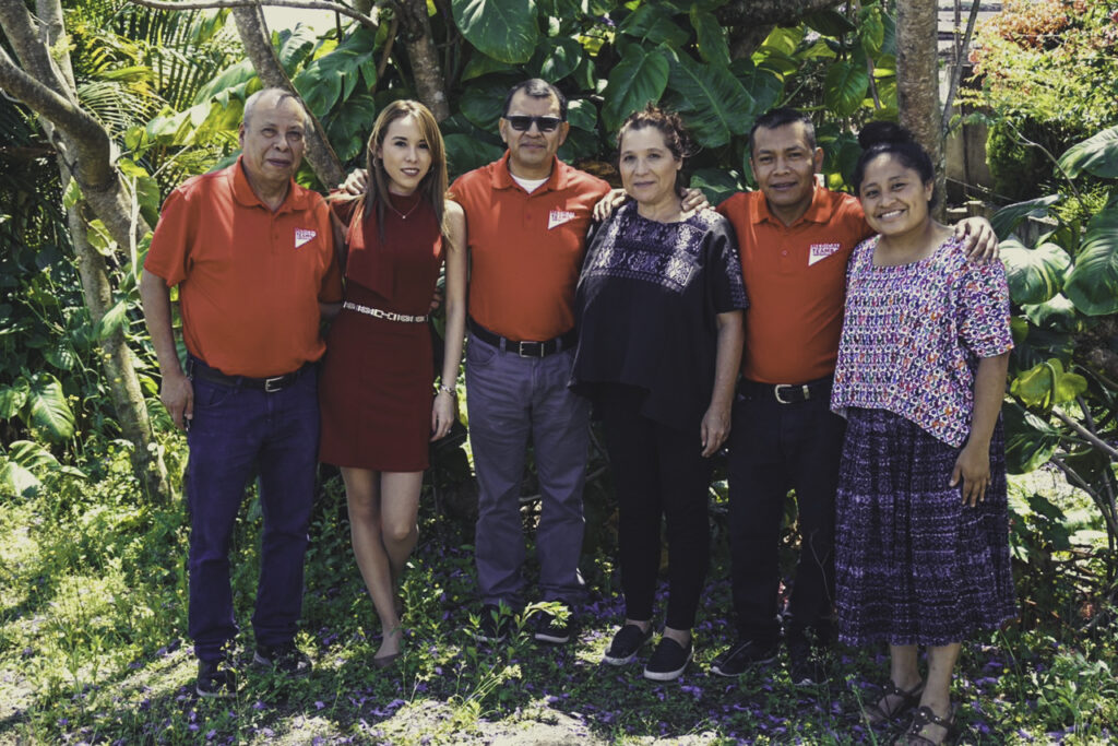 Six Guatemala staff pose for a photo