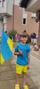 Maryna's son with a Ukrainian flag on Ukrainian Independence Day