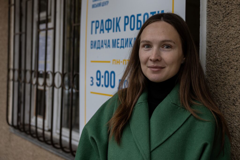Ukraine photo: a woman in a green coat, smiling