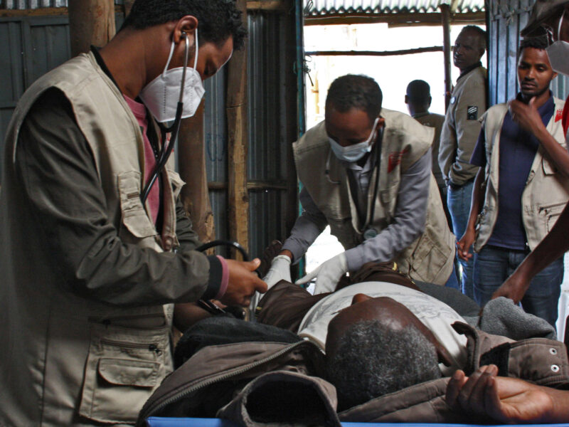 Dr. Muluken Zeleke attends to the patient from the ambulance, 2022