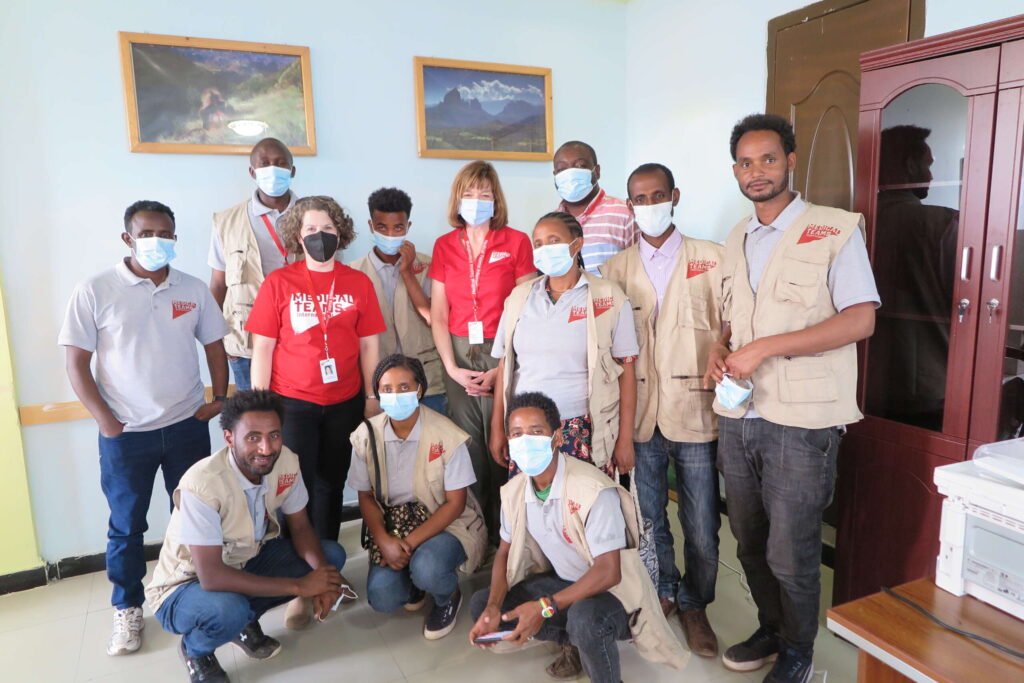 A group stands together in an Ethiopia office