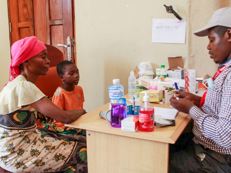 Mwalibola and her son Akim at the screening center in Tanzania.