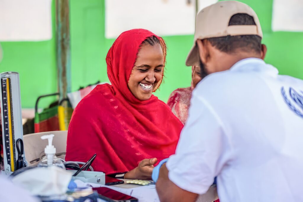 best photos of 2023 - a woman in red smiles