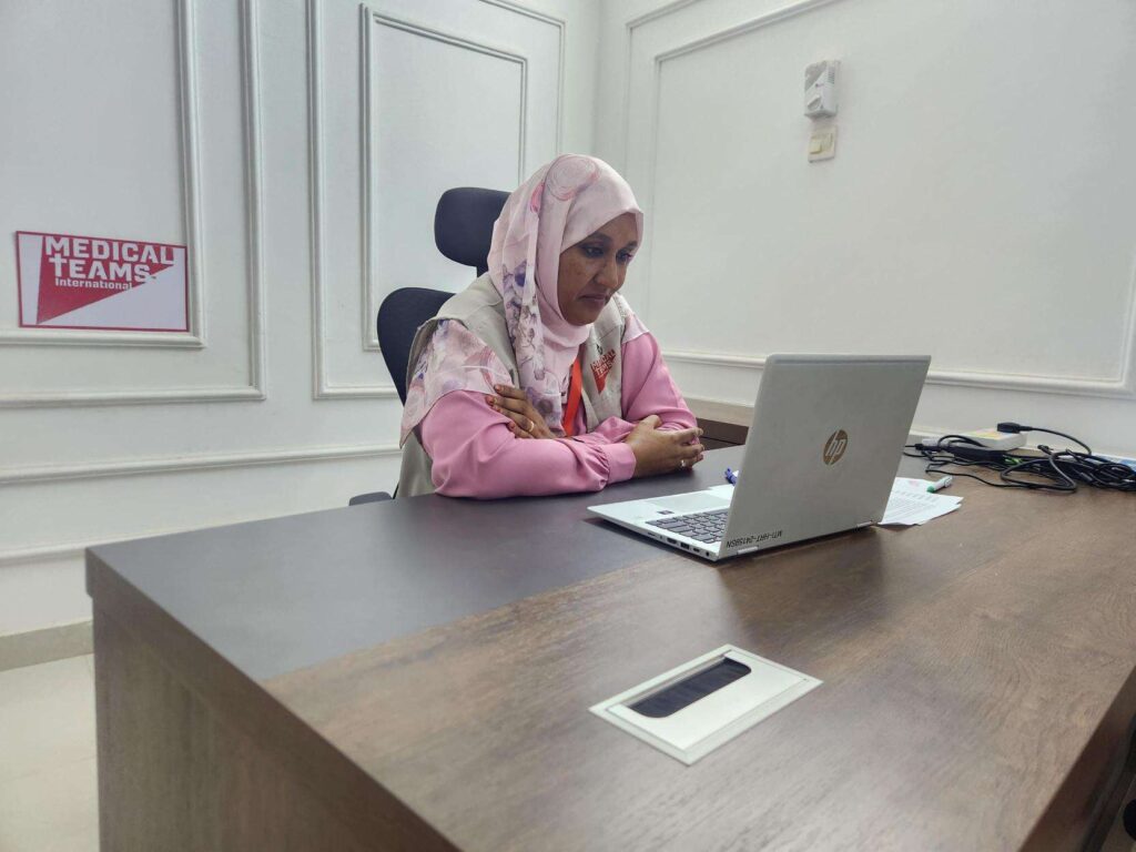 Salma Salah discusses women in Sudan with Martha from her office