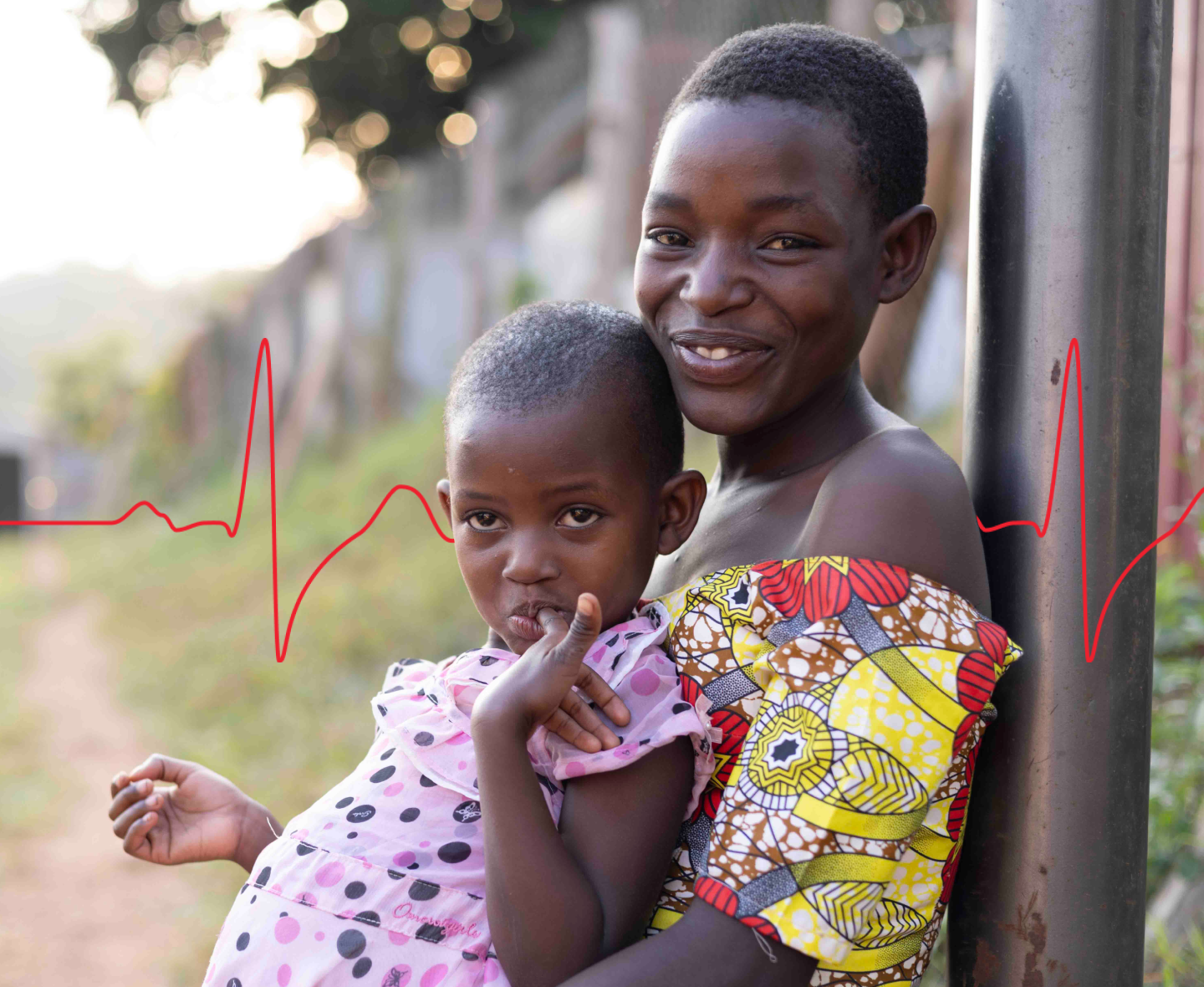 Uganda, Young girls smiling in the Kyaka II clinic