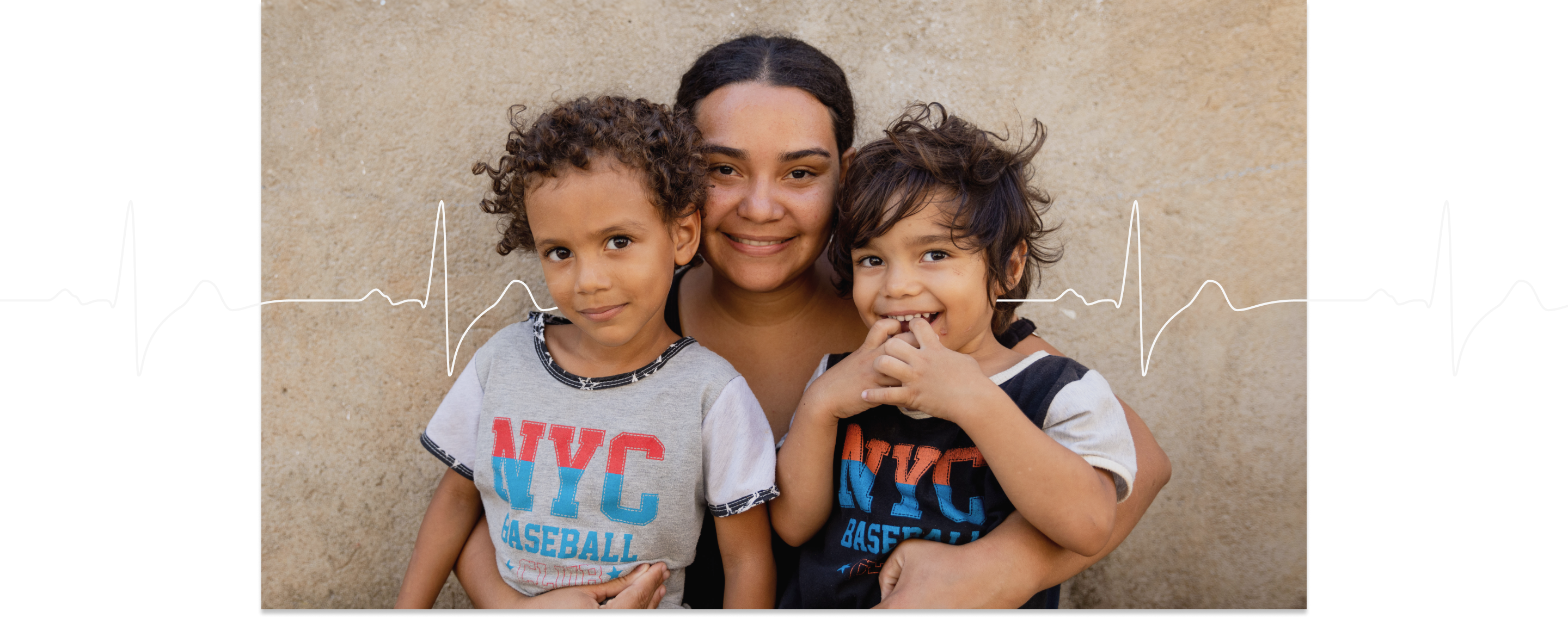 Nelimar and her sons Isaac and Andrew outside their home in Colombia