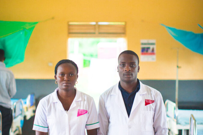 Two Medical Teams health workers stand in a clinic in Uganda, 2016