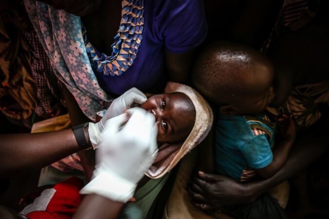 A baby is assessed by a Medical Teams health worker in Uganda, 2017.