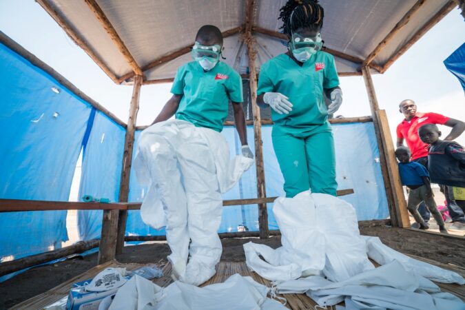Two Medical Teams health workers in PPE in Uganda, 2019.