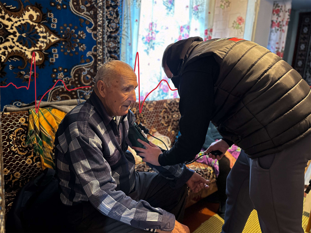 In Ukraine, a man has his blood pressure checked.