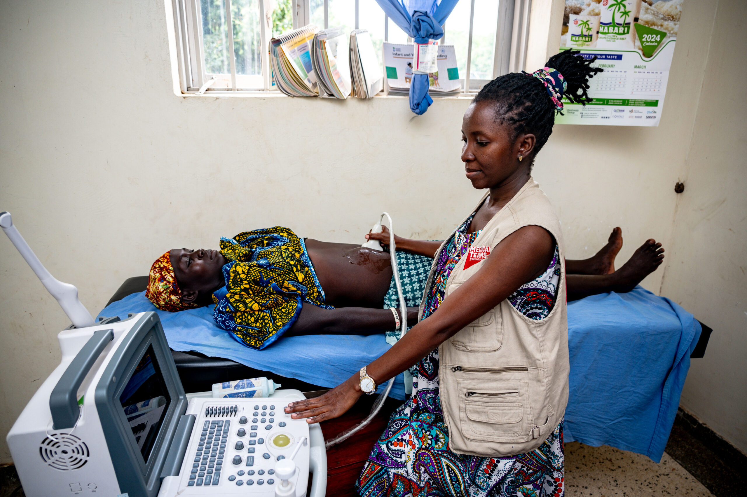 Radiographer Sarah Babirye scans a mother during an antenatal visit.