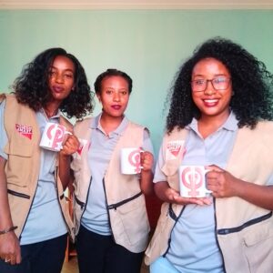 Medical Teams staff members in Colombia, posing for International Women's Day with mugs