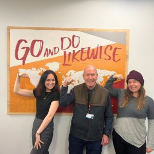 Medical Teams staff members and volunteer in the accelerate action pose for International Women's Day