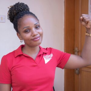 Medical Teams staff member in the accelerate action pose for International Women's Day