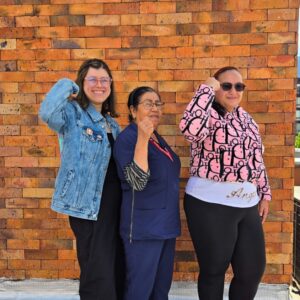 Medical Teams staff members in the accelerate action pose for International Women's Day