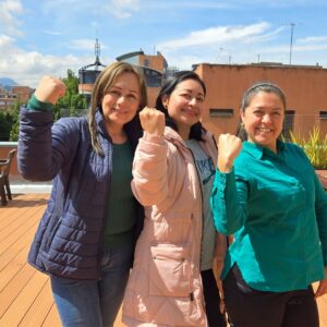 Medical Teams staff members in the accelerate action pose for International Women's Day