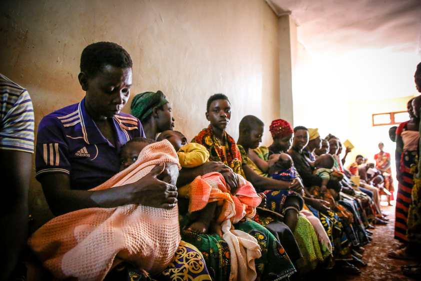 A line of patients waiting outside of a Refugee Children's Clinic in Tanzania.
