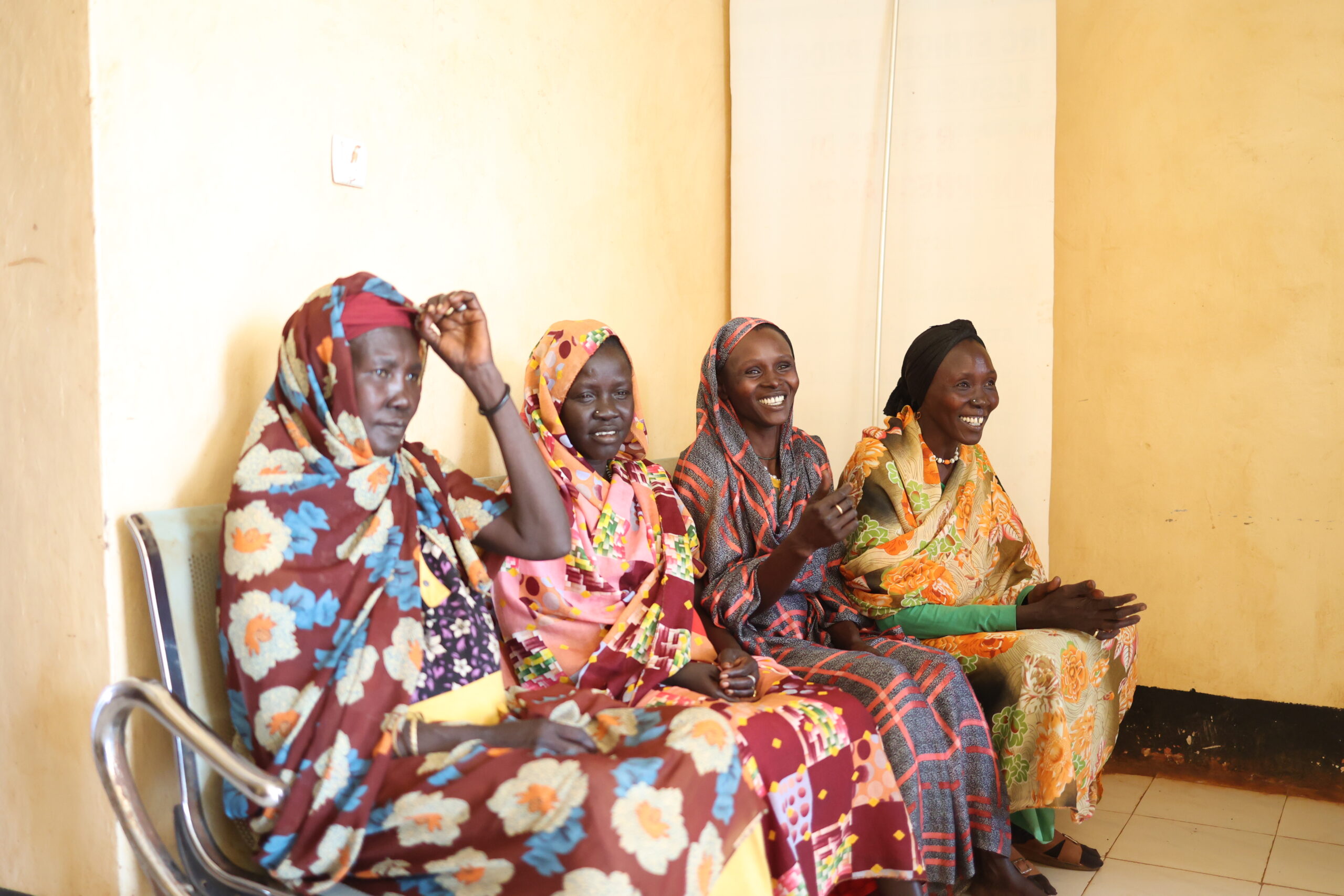 A group of women gathered outside the maternity ward.