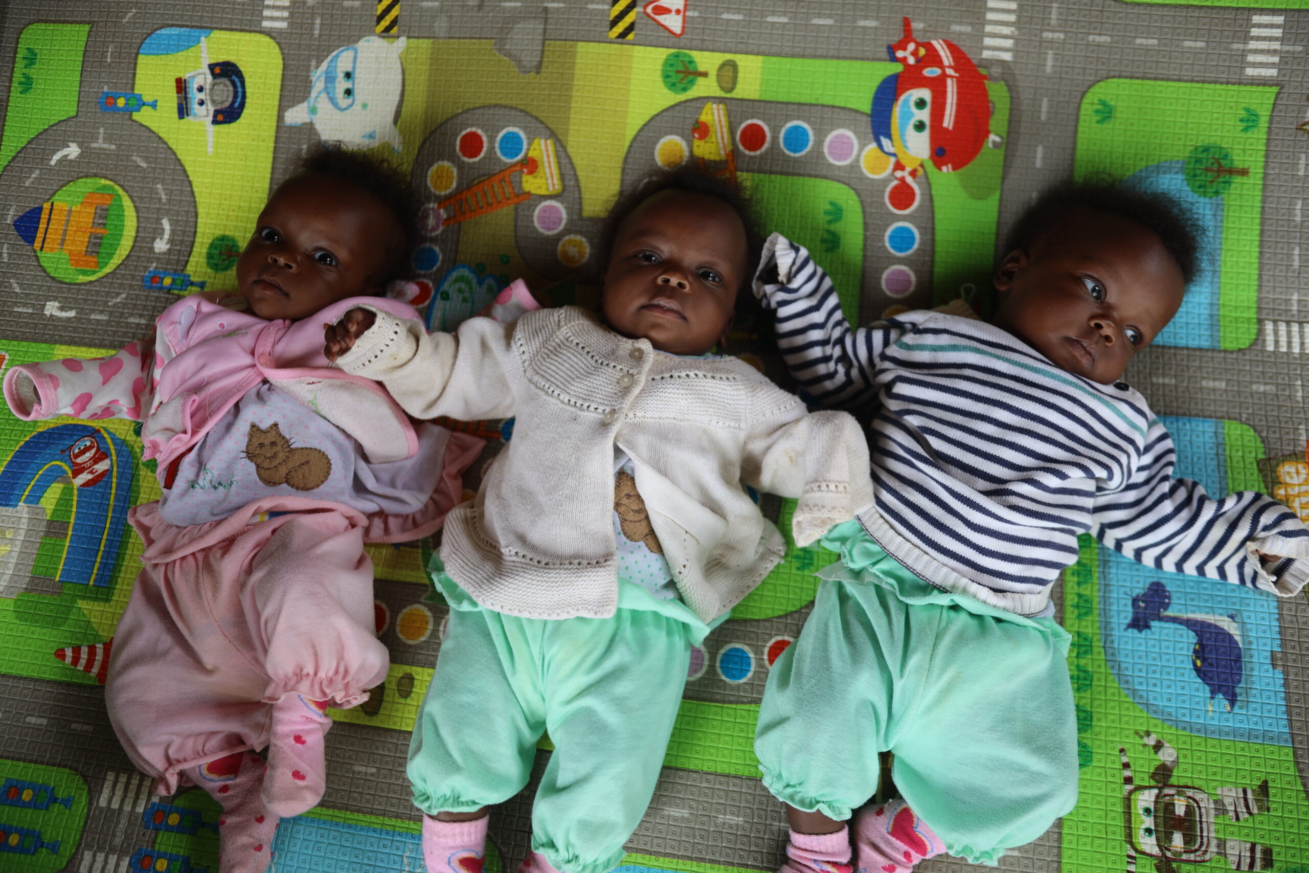A portrait of Nzariturike's triplets. 