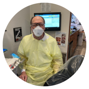 Dr. Jim Flerchinger working in one of our Care & Connect mobile dental clinics. 
