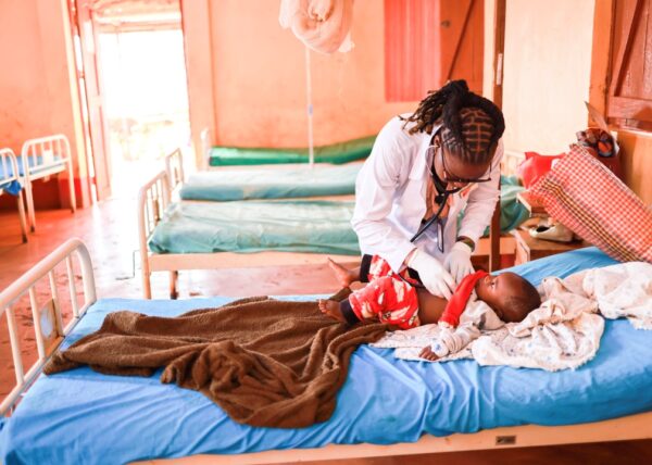 Dr. Jane, a Medical Teams doctor in Tanzania checks on a child patient.