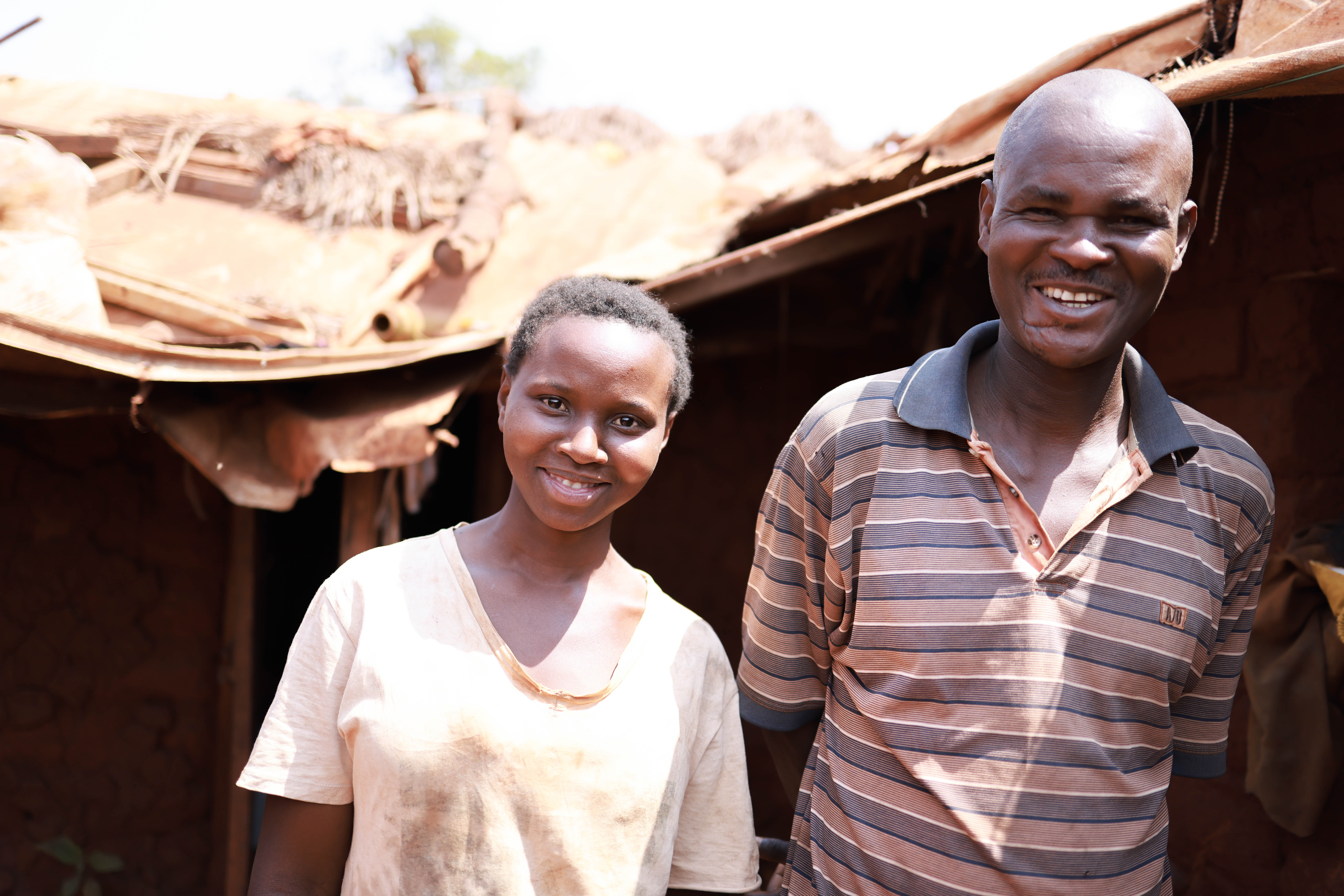Richard and Oleria standing outside their home.