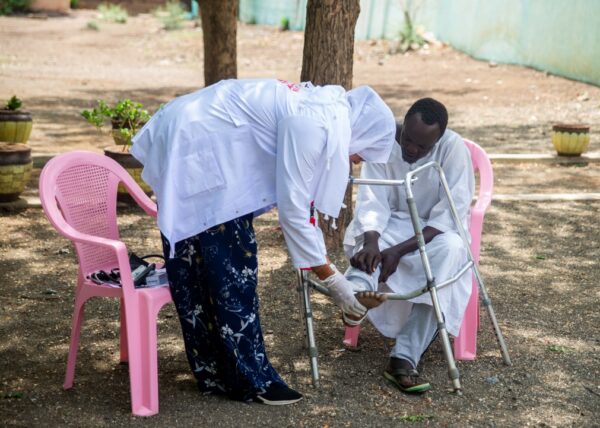 Dr. Marwa checks on a patient in Sudan.