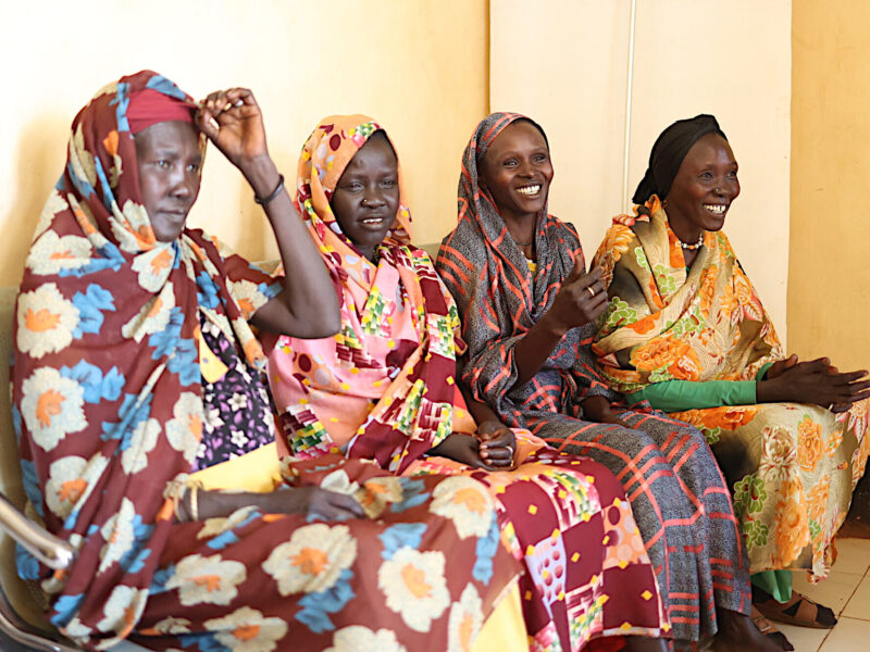 A group of women gathered outside the maternity ward.