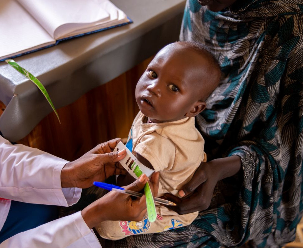 Sudan, Nutrition assistant taking MUAC for Ramadan