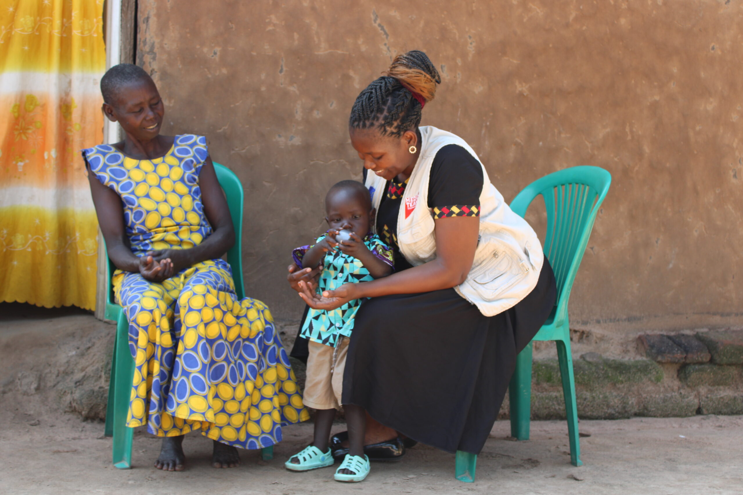 Ramsey and Betty visiting with our staff at the camp clinic. 