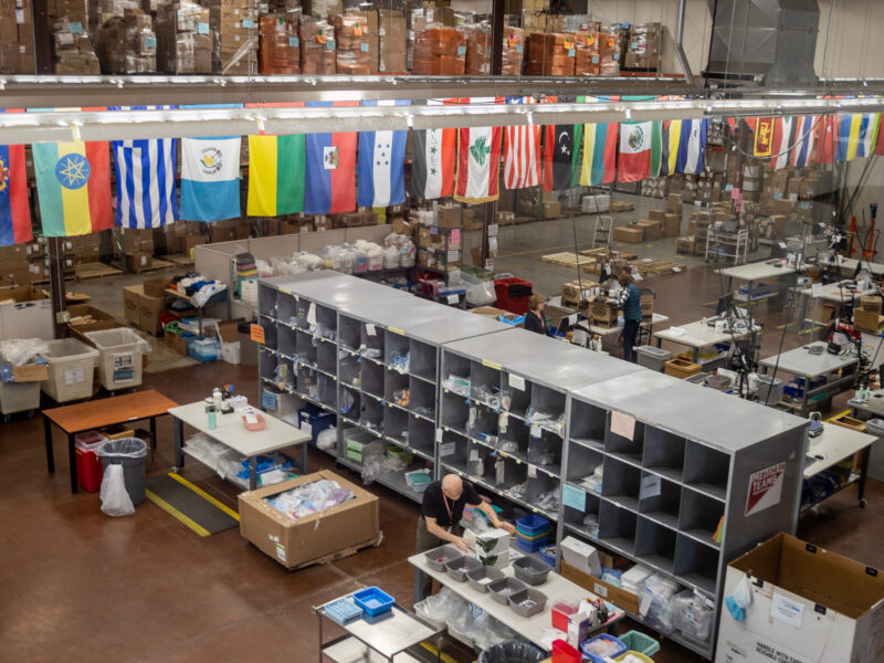 Volunteers packing medical supplies in our Distribution Center at the Tigard Headquarters.